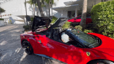 Red on black Ferrari 488 Spider for rent Miami gif mph club