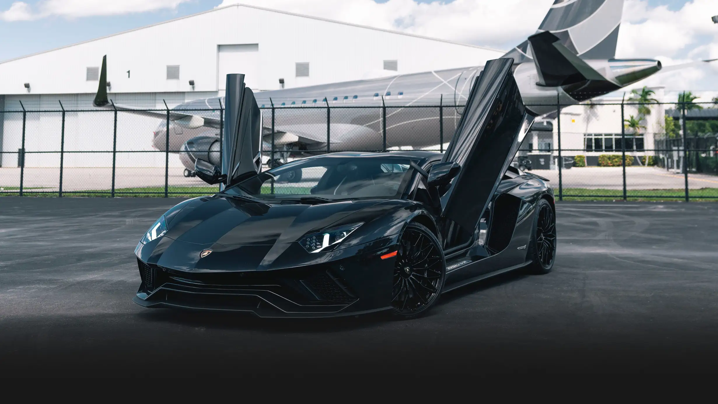 Black Lamborghini Aventador S Roadster rental profile view mph club