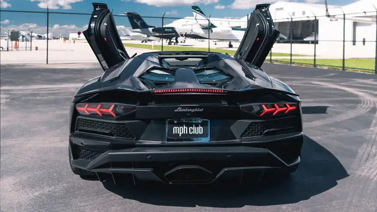 Black Lamborghini Aventador S Roadster rental rear view mph club