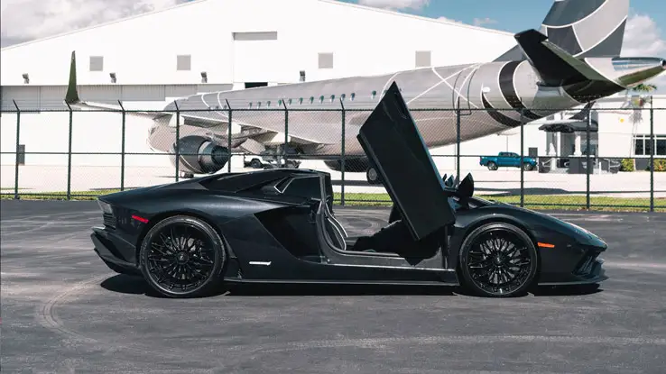 Black Lamborghini Aventador S Roadster rental side view mph club