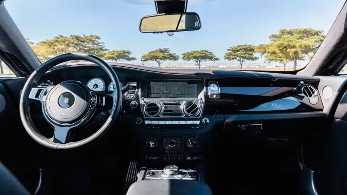 Black on black Rolls Royce Wraith rental Miami dashboard view mph club