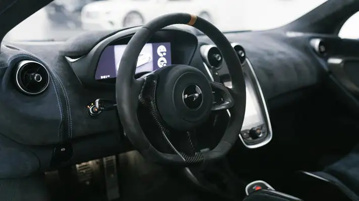 Blue McLaren 600lt rental dashboard view mph club