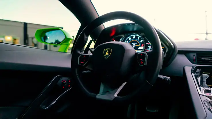 Green Lamborghini Aventador rental interior view mph club