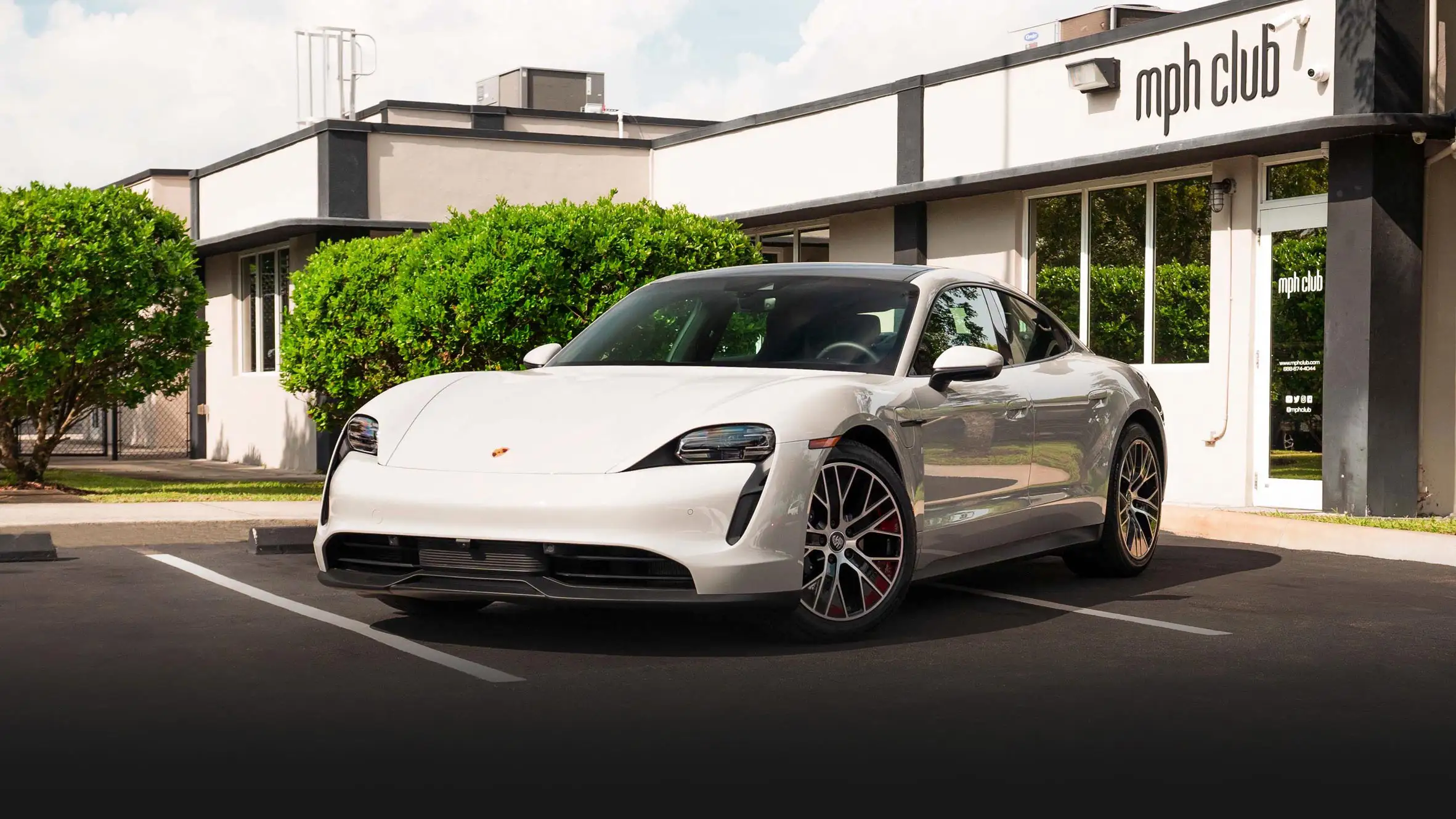 Grey on black Porsche Taycan rental Miami profile view mph club