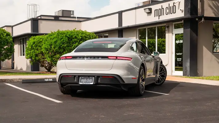 Grey on black Porsche Taycan rental Miami rear view mph club