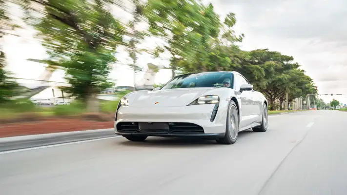 Grey on black Porsche Taycan rental Miami rolling view mph club