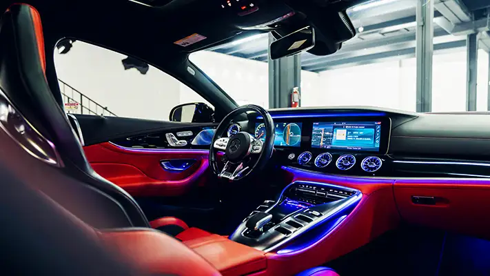 Grey on red Mercedes Benz GT 63 rental dashboard view mph club