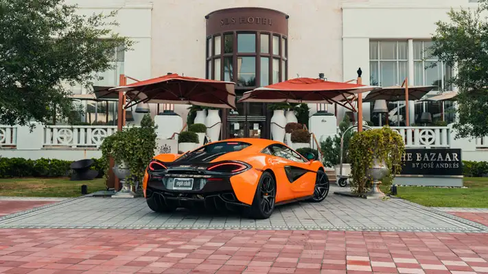 Orange McLaren 570s rental rear view mph club