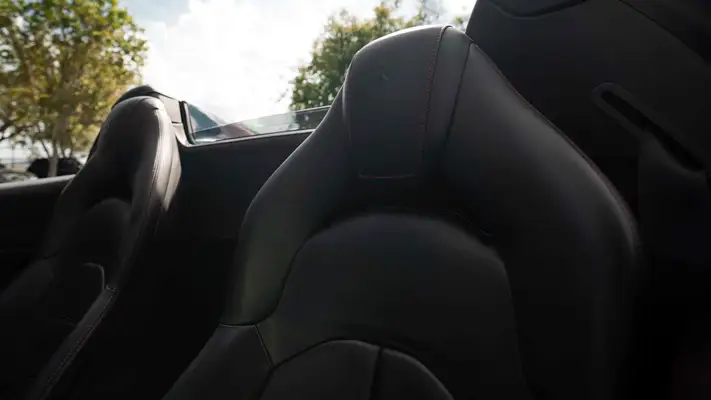 Red on black Ferrari 488 Spider for rent miami interior view mph club