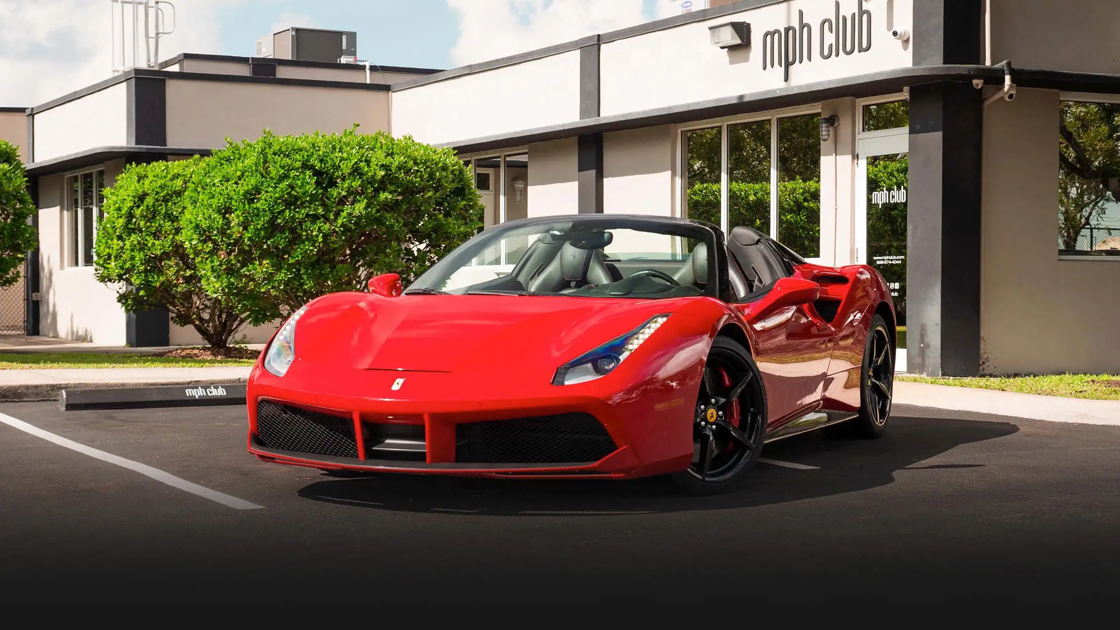 Red on black Ferrari 488 Spider for rent miami profile view mph club