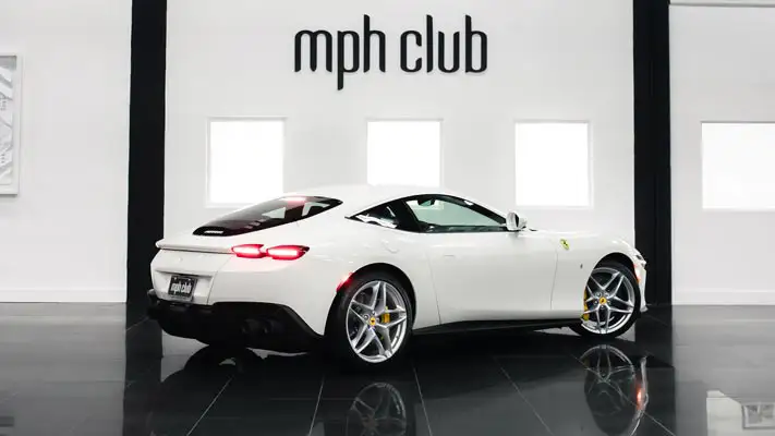White Ferrari Roma rental Miami rear view mph club