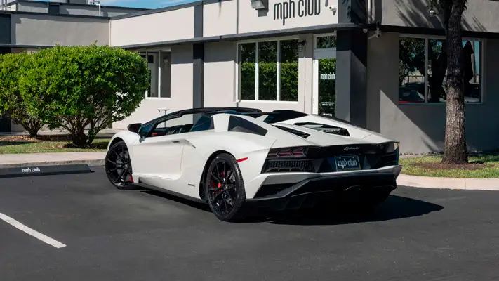 White Lamborghini Aventador S Roadster for rent Miami rear view mph club