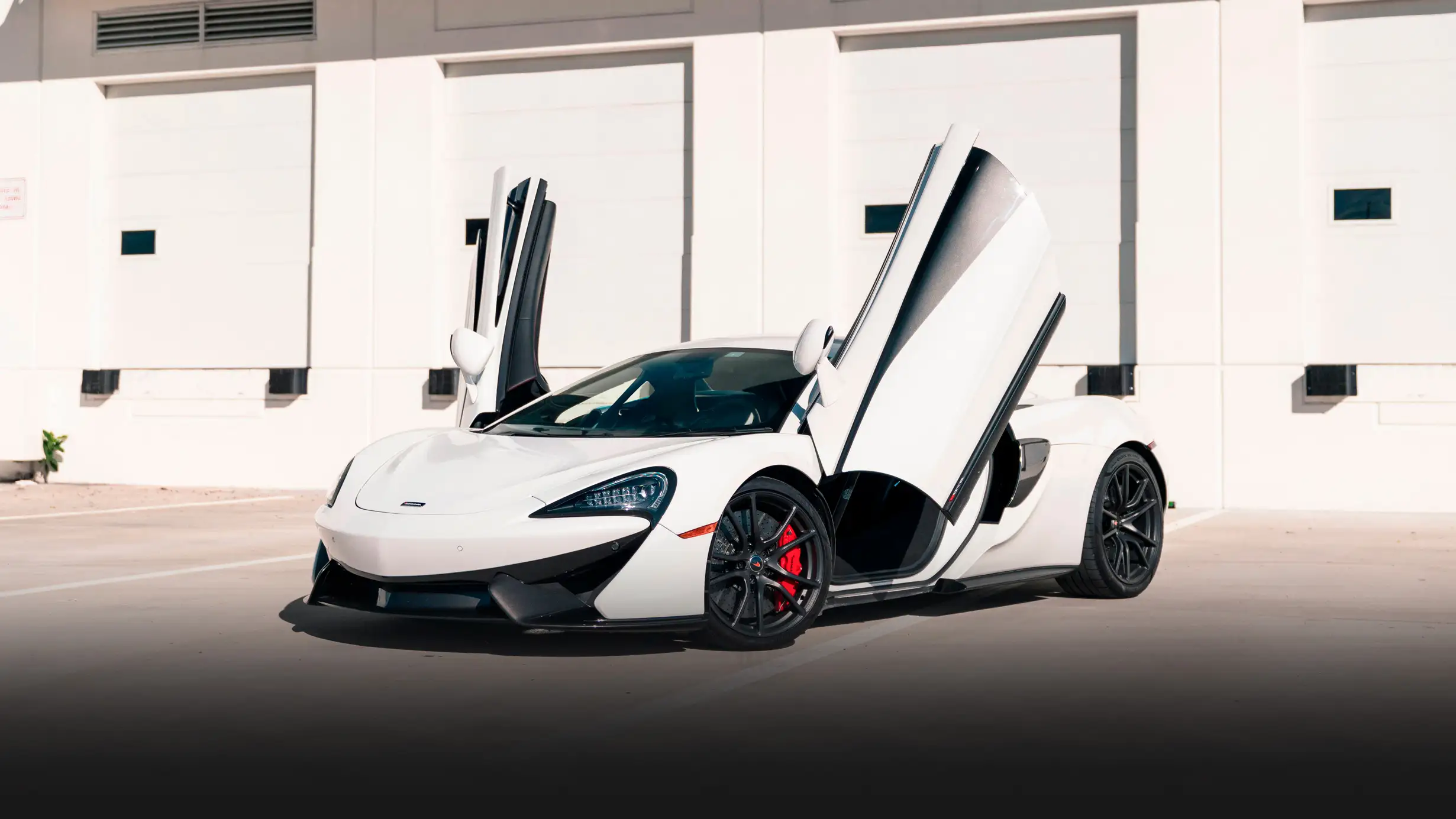 White McLaren 570s rental profile view mph club