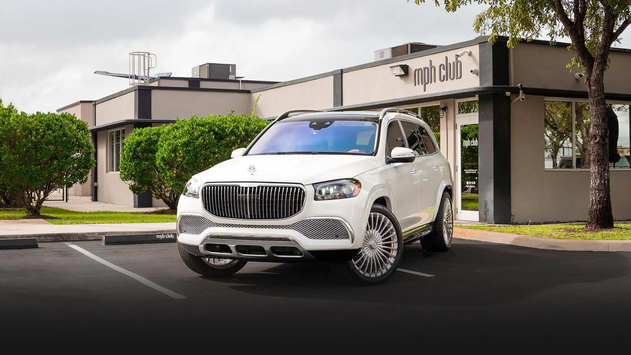 White Mercedes Maybach SUV rental profile view mph club