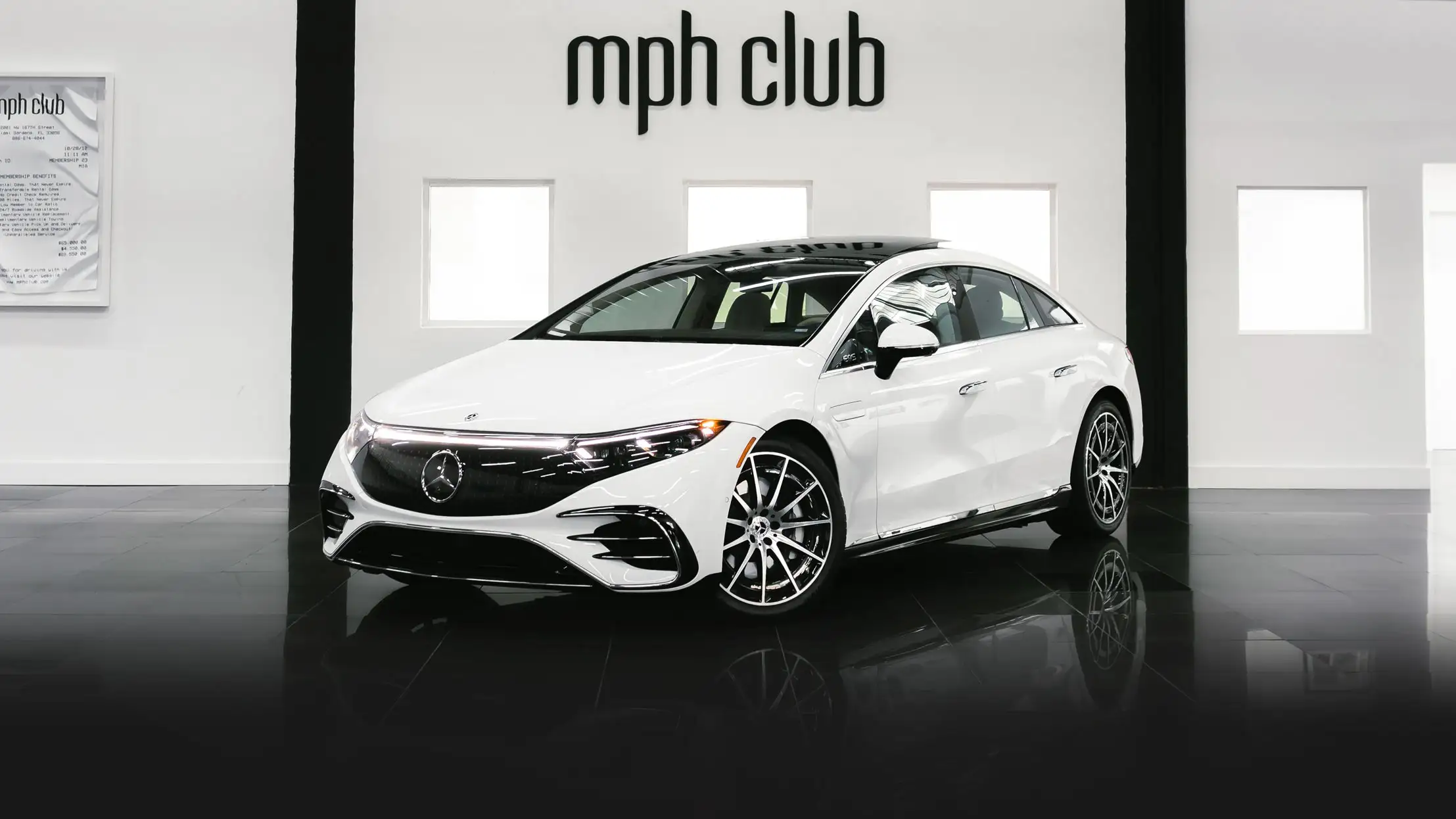 White on white Mercedes Benz EQS rental Miami profile view mph club