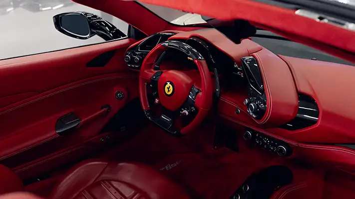 White on red Ferrari 488 Spider for rent dashboard view mph club