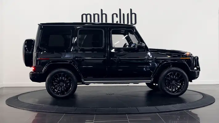 Black on red Mercedes Benz G550 rental side view turntable mph club