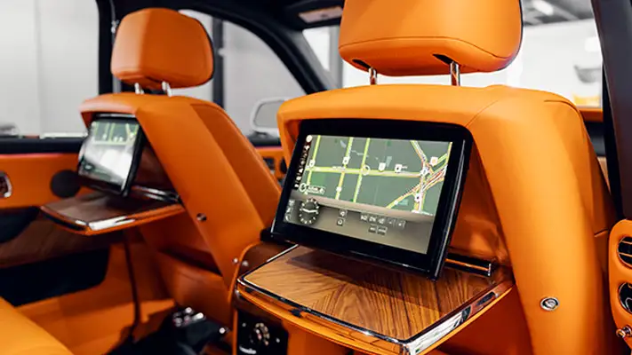 White exterior with orange interior Rolls Royce Cullinan rental interior view mph club