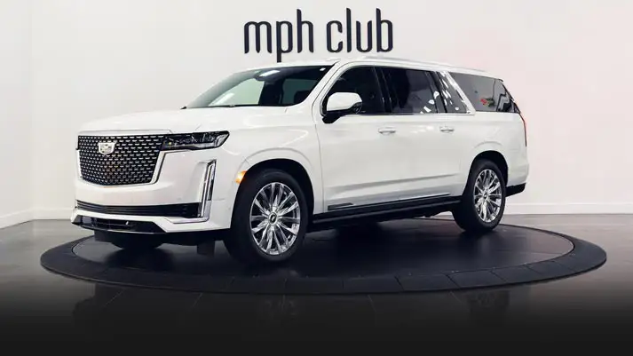 White on black Cadillac Escalade rental profile view turntable rszd mph club