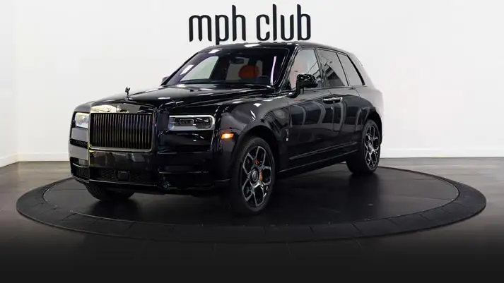 Black on orange Rolls Royce Cullinan black badge rental profile view rszd mph club