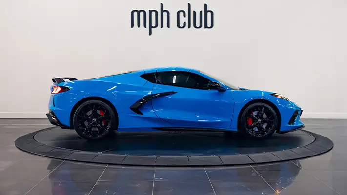 Blue Chevrolet Corvette C8 rental side view - mph club turntable