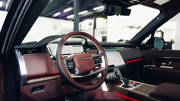 Blue Range Rover rental Miami dashboard view mph club