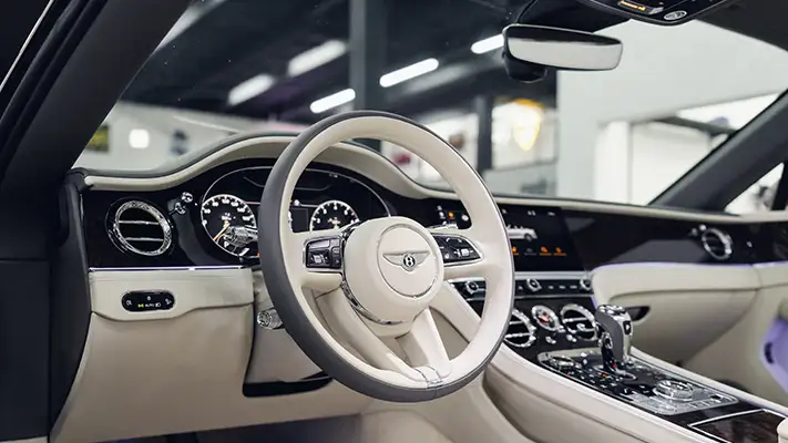 Gold Bentley Continental GTC rental dashboard view - mph club