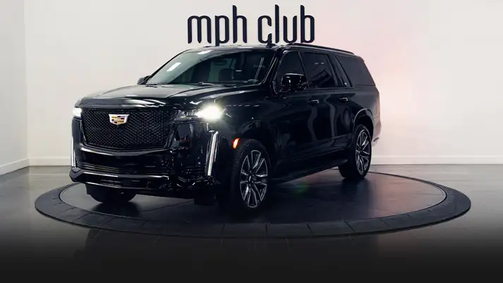 Black on black Cadillac Escalade rental profile view turntable rszd - mph club