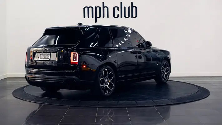 Black on red Rolls Royce Cullinan rental rear view - mph club