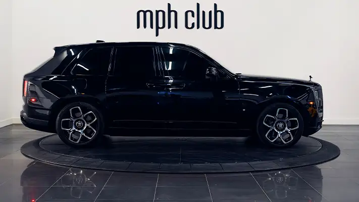 Black on red Rolls Royce Cullinan rental side view - mph club