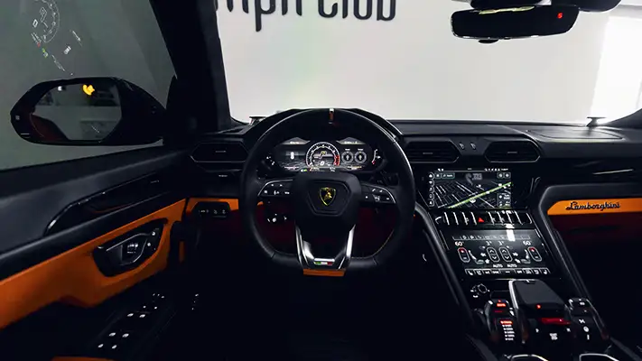 Grey on orange Lamborghini Urus for rent Miami dashboard view - mph club