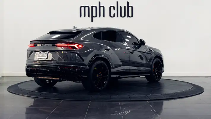 Grey on orange Lamborghini Urus for rent Miami rear view - mph club