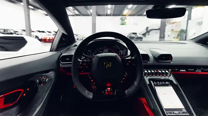White Lamborghini Huracan Tecnica rental Miami dashboard view - mph club