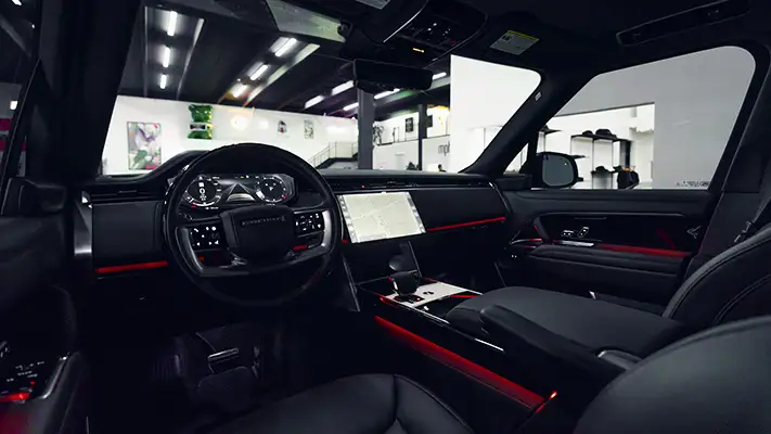 Black on black Range Rover rental dashboard view - mph club
