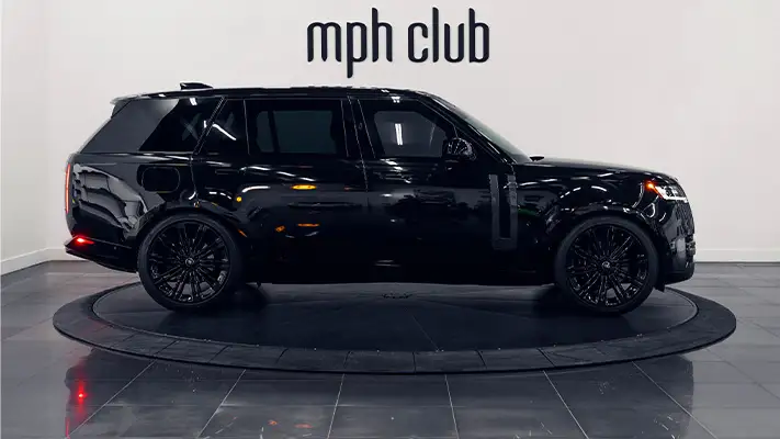 Black on black Range Rover rental side view - mph club